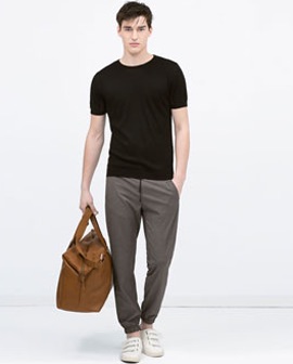 a male model holding a soft rucksack