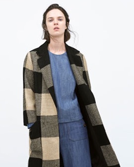 a female model wearing a jacquard coat